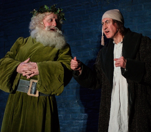 Stephen Brennan as The Ghost of Christmas Present and Barry McGovern as Scrooge in the 2009 Gate production of  'A Christmas Carol'. Photo Patrick Redmond